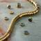 12 Pack: Gold Hematite Heishi Beads by Bead Landing™